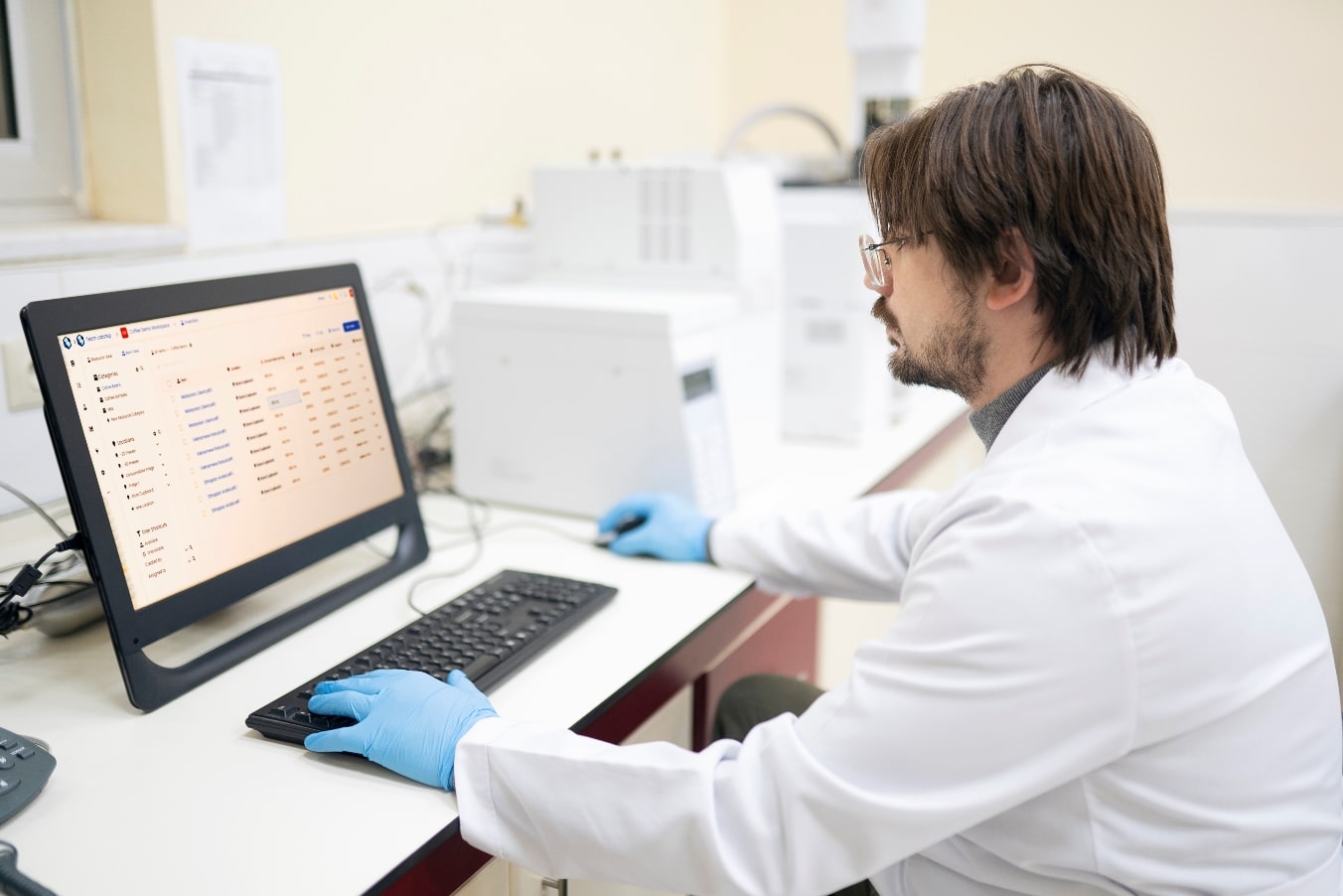 Laboratory technician working at the computer